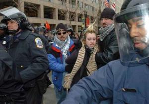 Police men leading away a very dangerous suspect (no doubt).