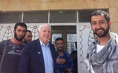 Senator John McCain and former US presidential candidate leaving a meeting ISIS chief Abu Bakr Al Baghdadi