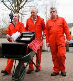 Edward Horgan, John Lannon and Niall Farrell present wheelbarrows of information about illegality at Shannon to the Gardai (March 2011)