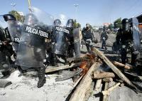 riot-cops entering oaxaca