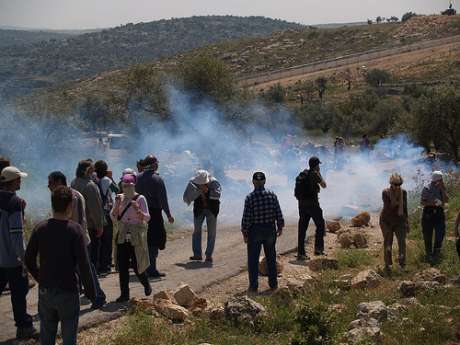 Israeli Occupation Forces fire tear gas at demonstrators