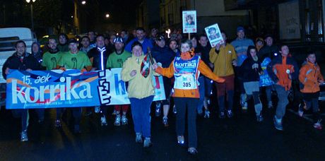 Section of the 15th Korrika running through the night (note woman in front carrying the baton -- see story above)