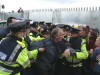 Gardai manhandle a local man at the Shell compound, Glengad beach, August 2008