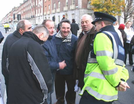 Some Erris men share a joke with a garda