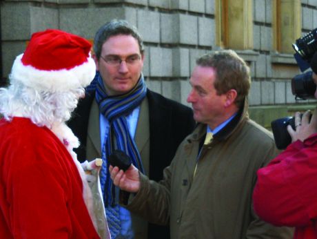 Enda Kenny TD is given coal by Santa