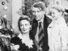 George Bailey (James Stewart), Mary Bailey (Donna Reed), and their youngest daughter Zuzu (Karolyn Grimes) in It’s a Wonderful Life.
