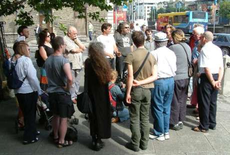 Supporters are briefed on day's proceedings in court.