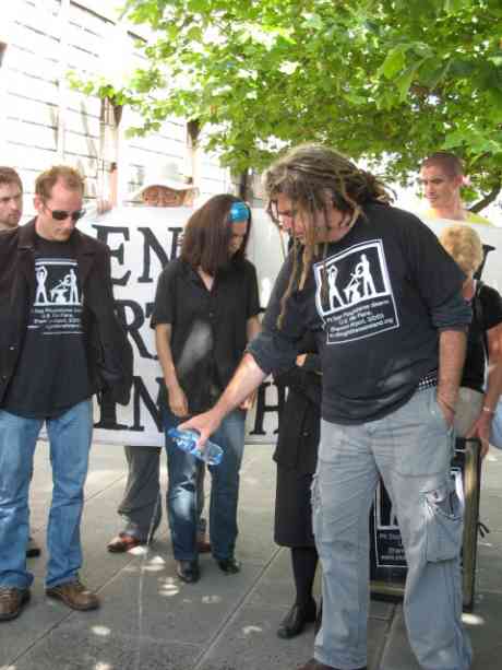 Ciaron pouring a chaoi for  the victims of war