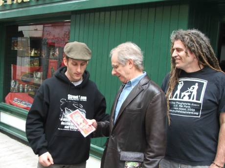 Damien presenting Ken Loach with Peace On Trial DVD - Not quite up to Ken's standards!
