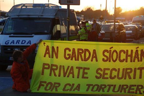 Gardai security hide their faces from the cameras