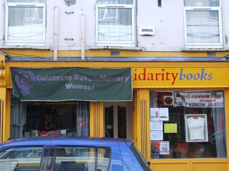 Banner on Solidarity Books, Douglas St., all day
