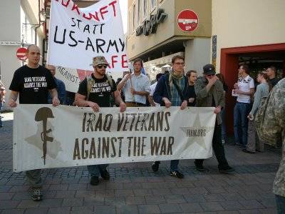 Fomer Marine Sergeant Adam Kokesh leads a peace march in Ansbach