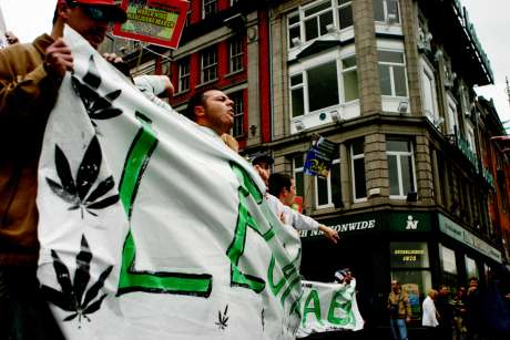 Marchers carry the Legalise Cannabis banner