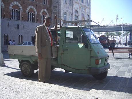 Nick Macharia with the little 3 wheeler he took such a liking to in the Genovese waterfront