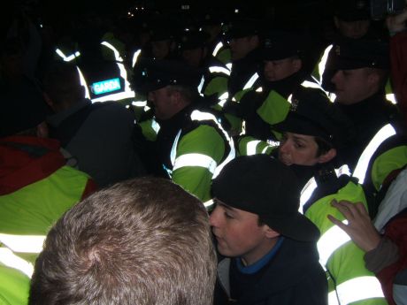 Scuffles break out as Gardai force back protesters.