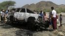 People gather at the site of a drone strike on the road between Yafe and Radfan districts of the southern Yemeni province of Lahj August 11, 2013. (Reuters)