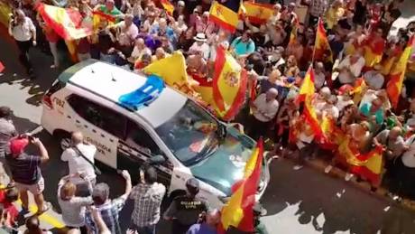 crowds screamed "let them fucking have it!" as the paramilitary Guardia Civil vans left for Catalonia this week.
